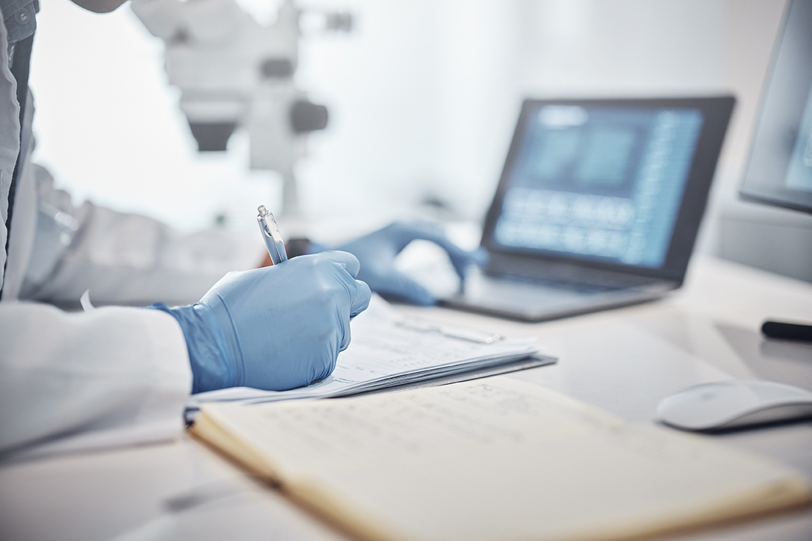 Science, research and hands in lab with notebook and computer on scientific analysis.